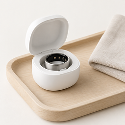 The LYNX smart ring seated in its white charging case
